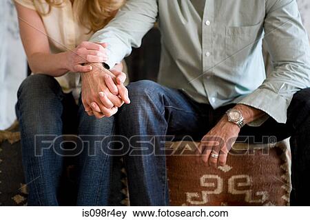 Couple holding hands View Large Photo Image Stock Photo - Couple holding hands. Fotosearch