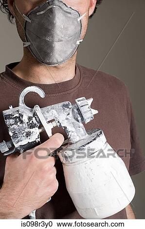Decorator holding paint supplies and wearing face mask View Large Photo Image Stock Image - Decorator holding paint supplies and wearing face mask. Fotosearch