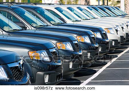 Stock Photo - New cars in parking lot. Fotosearch