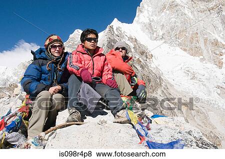 Stock Photo - People mountaineering in the himalayas. Fotosearch