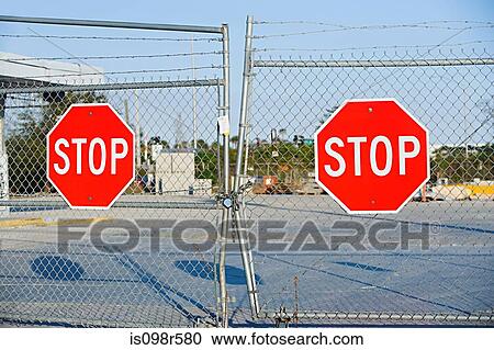 Stop signs on gates View Large Photo Image Stock Image - Stop signs on gates. Fotosearch