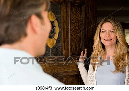 Woman opening door View Large Photo Image Stock Image - Woman opening door. Fotosearch