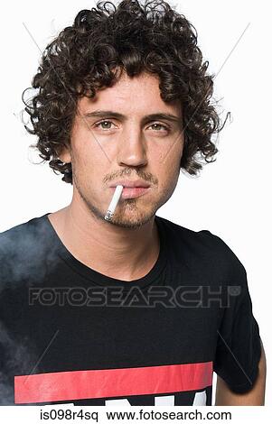 Stock Photography - Young man smoking. Fotosearch