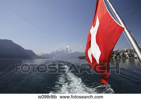 Stock Image - Lake lucerne and swiss flag. Fotosearch