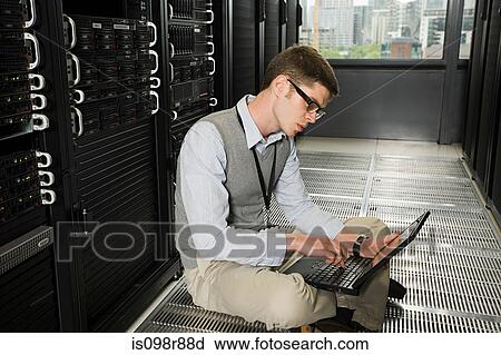 Male computer technician working View Large Photo Image Stock Image - Male computer technician working. Fotosearch