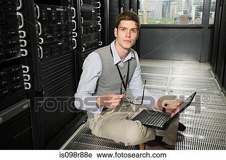 Male computer technician working View Large Photo Image Stock Image - Male computer technician working. Fotosearch