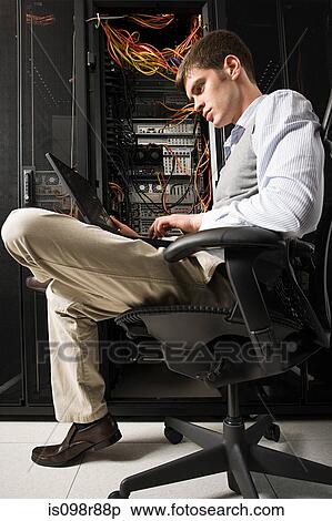 Stock Photography - Male computer technician working. Fotosearch