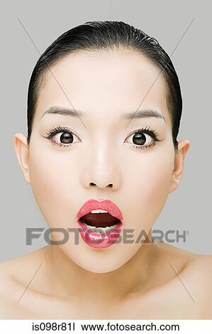 Stock Image - Shocked young woman. Fotosearch