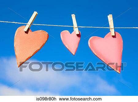 Three hearts on a washing line View Large Photo Image Stock Image - Three hearts on a washing line. Fotosearch