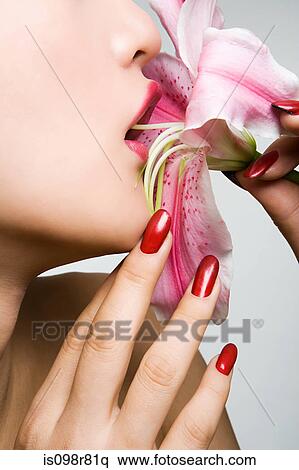 Woman eating a lily View Large Photo Image Stock Photography - Woman eating a lily. Fotosearch