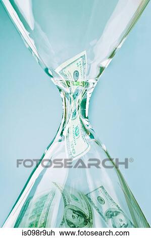 Banknotes in an hourglass View Large Photo Image Stock Image - Banknotes in an hourglass. Fotosearch