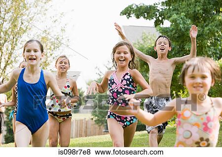Stock Photo - Children playing in garden. Fotosearch