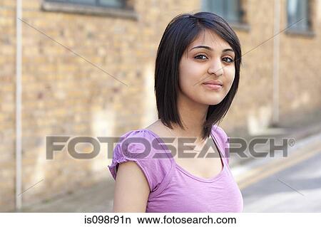 Picture - Portrait of teenage girl in street. Fotosearch