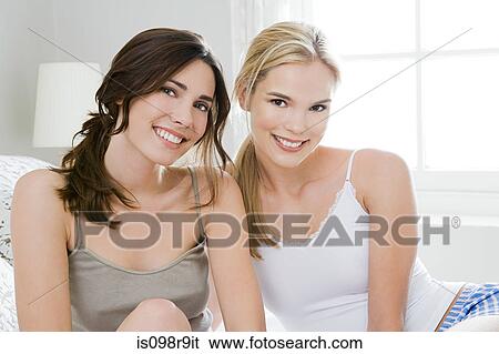Two young women View Large Photo Image Stock Photograph - Two young women. Fotosearch
