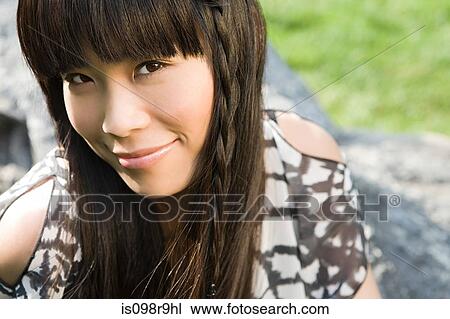 Stock Image - Young woman outdoors. Fotosearch