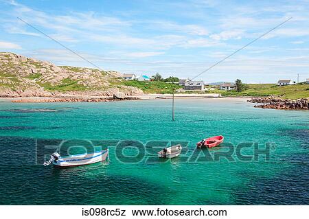 Stock Photo - Boats in a cove on mull. Fotosearch