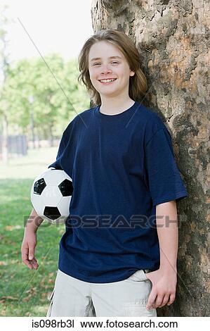Boy with football View Large Photo Image Stock Image - Boy with football. Fotosearch