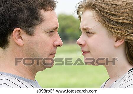 Stock Image - Father and son face to face. Fotosearch