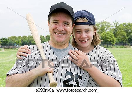 Father and son on baseball field View Large Photo Image Stock Image - Father and son on baseball field. Fotosearch