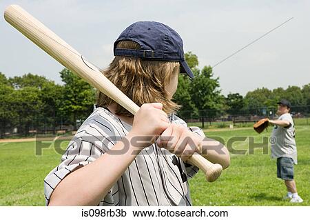 Stock Image - Father and son playing baseball. Fotosearch