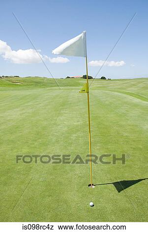 Flag on a golf course View Large Photo Image Stock Photo - Flag on a golf course. Fotosearch