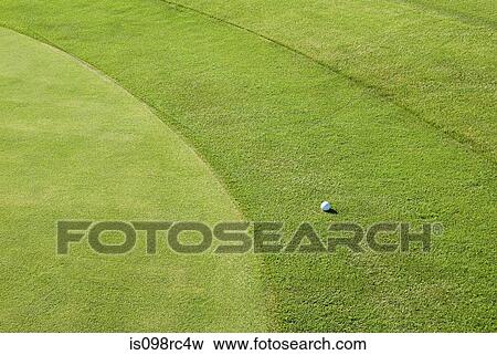 Stock Photo - Golf ball on golf course. Fotosearch