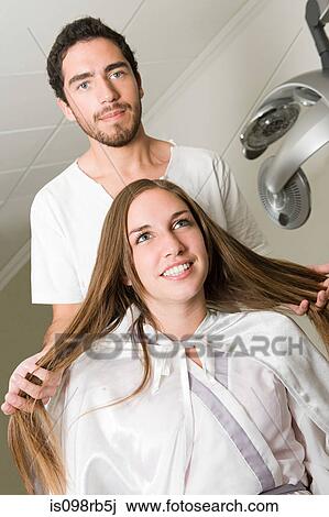 Hairdresser and girl with long hair View Large Photo Image Stock Image - Hairdresser and girl with long hair. Fotosearch