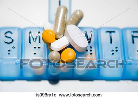 Pillbox with lots of tablets View Large Photo Image Stock Image - Pillbox with lots of tablets. Fotosearch