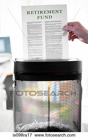 Stock Photo - Shredding retirement fund paperwork. Fotosearch