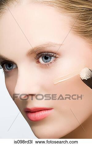 Woman applying foundation View Large Photo Image Stock Image - Woman applying foundation. Fotosearch