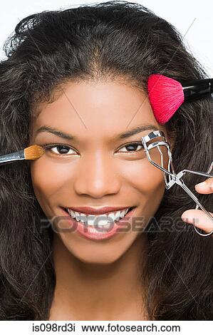 Woman having makeup done View Large Photo Image Stock Image - Woman having makeup done. Fotosearch