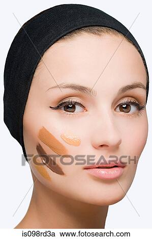 Woman with foundation on face View Large Photo Image Stock Image - Woman with foundation on face. Fotosearch