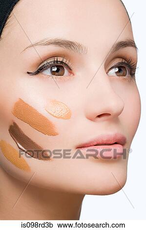 Woman with foundation on face View Large Photo Image Stock Image - Woman with foundation on face. Fotosearch