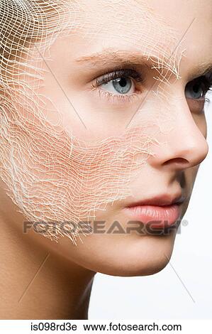 Stock Image - Woman with gauze on face. Fotosearch