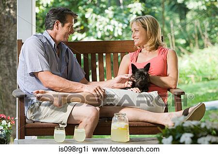 Couple on bench with dog View Large Photo Image Stock Image - Couple on bench with dog. Fotosearch