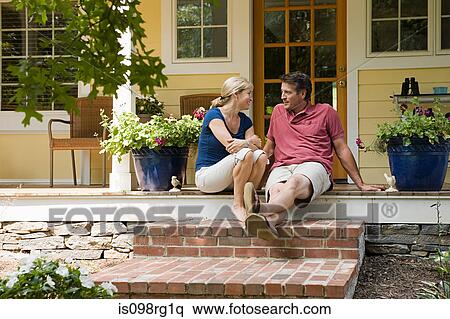Couple sitting on porch View Large Photo Image Stock Photography - Couple sitting on porch. Fotosearch