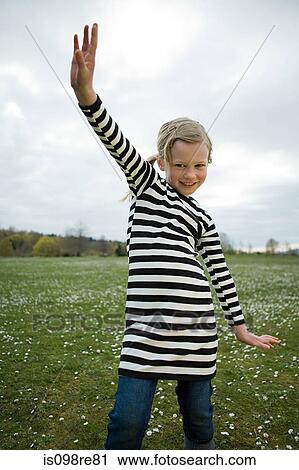 Stock Image - Girl with arm raised. Fotosearch