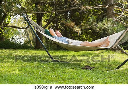 Man in a hammock View Large Photo Image Stock Image - Man in a hammock. Fotosearch
