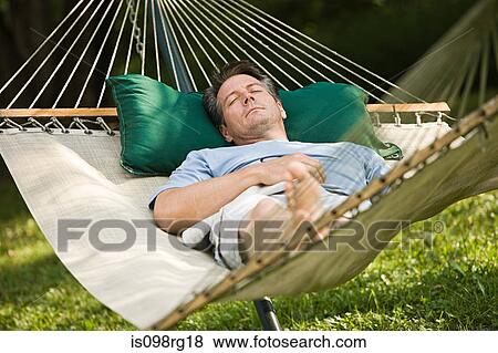 Man in a hammock View Large Photo Image Stock Photo - Man in a hammock. Fotosearch