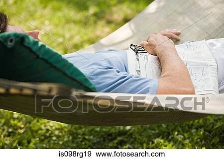Man in a hammock View Large Photo Image Stock Photo - Man in a hammock. Fotosearch