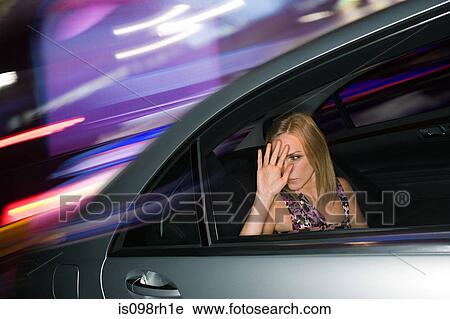 Woman in the back of a speeding car View Large Photo Image Stock Image - Woman in the back of a speeding car. Fotosearch