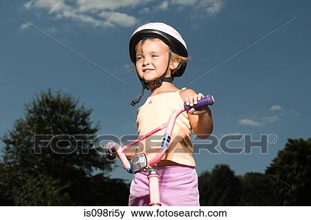 Stock Photo - Girl with bicycle. Fotosearch
