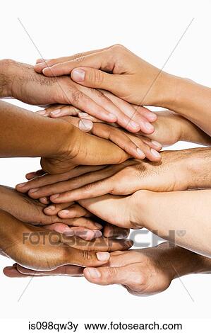 Hands on top of each other View Large Photo Image Stock Photo - Hands on top of each other. Fotosearch