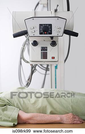 Stock Photo - Patient under a machine. Fotosearch