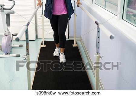 Person using support bars View Large Photo Image Stock Photo - Person using support bars. Fotosearch
