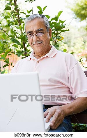 Stock Photography - Senior man with laptop computer. Fotosearch