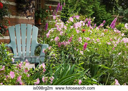 Chair in garden View Large Photo Image Picture - Chair in garden. Fotosearch