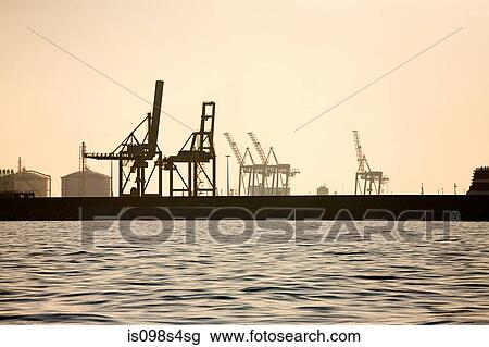 Loading cranes at harbour View Large Photo Image Stock Image - Loading cranes at harbour. Fotosearch