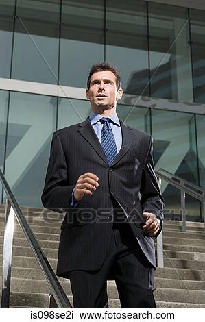 A business man running down a steps View Large Photo Image Stock Image - A business man running down a steps. Fotosearch
