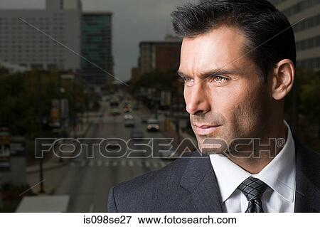 Head shot of a suited businessman View Large Photo Image Stock Photo - Head shot of a suited businessman. Fotosearch